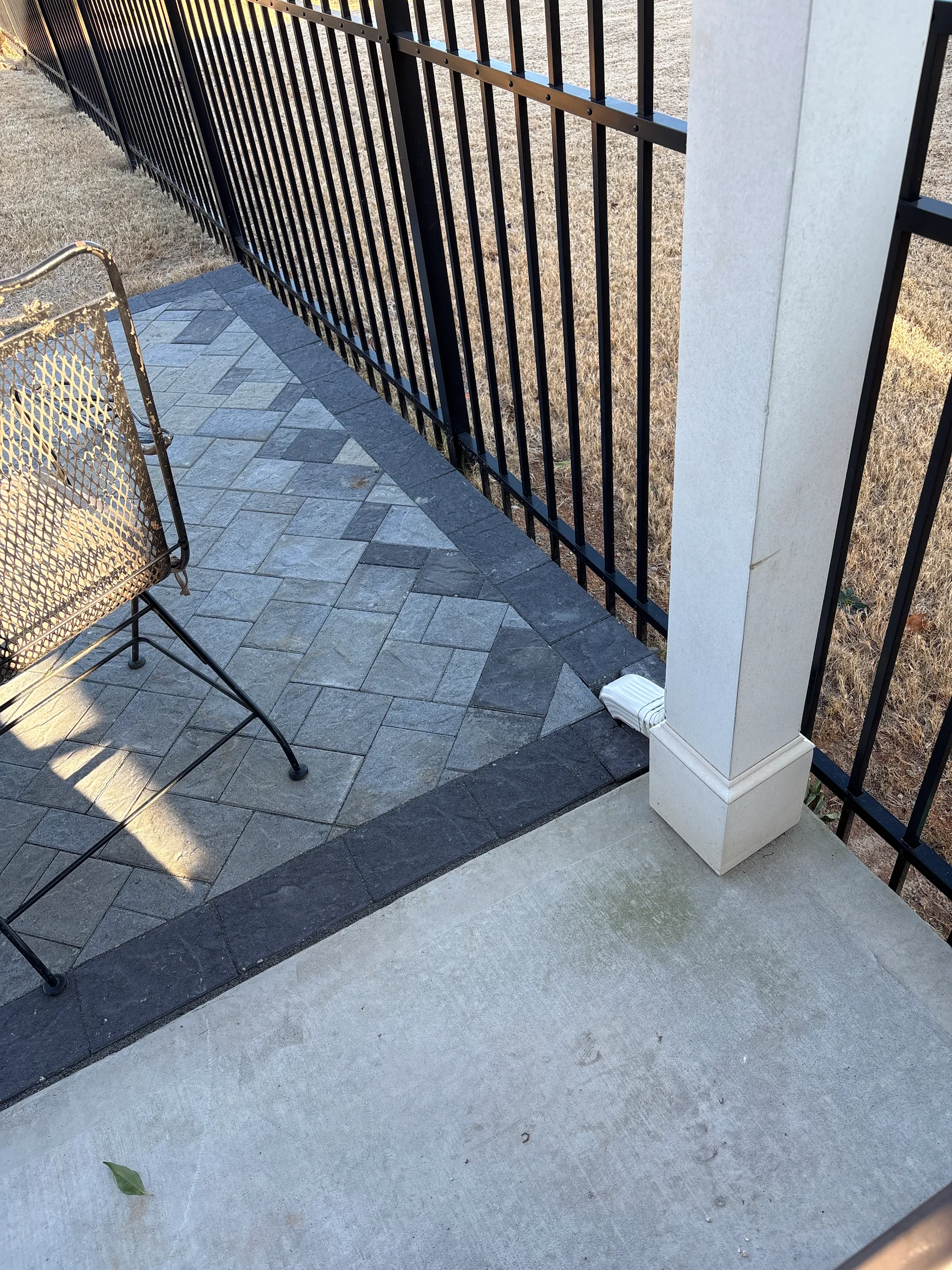 Small paver patio with installed underground drainage